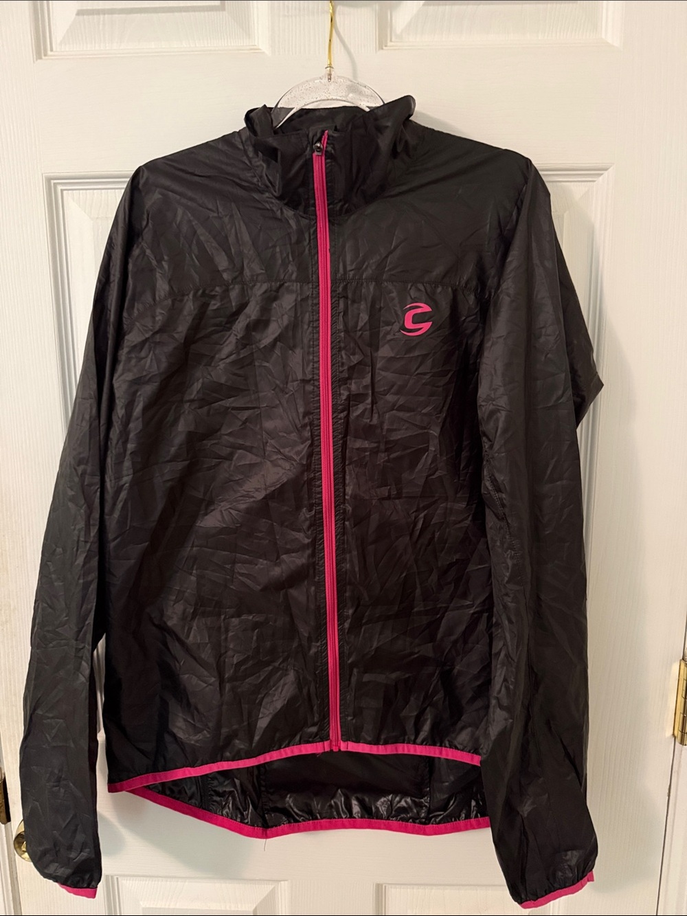 Cannondale Women’s Lightweight Black Windbreaker Jacket with Pink Trim.